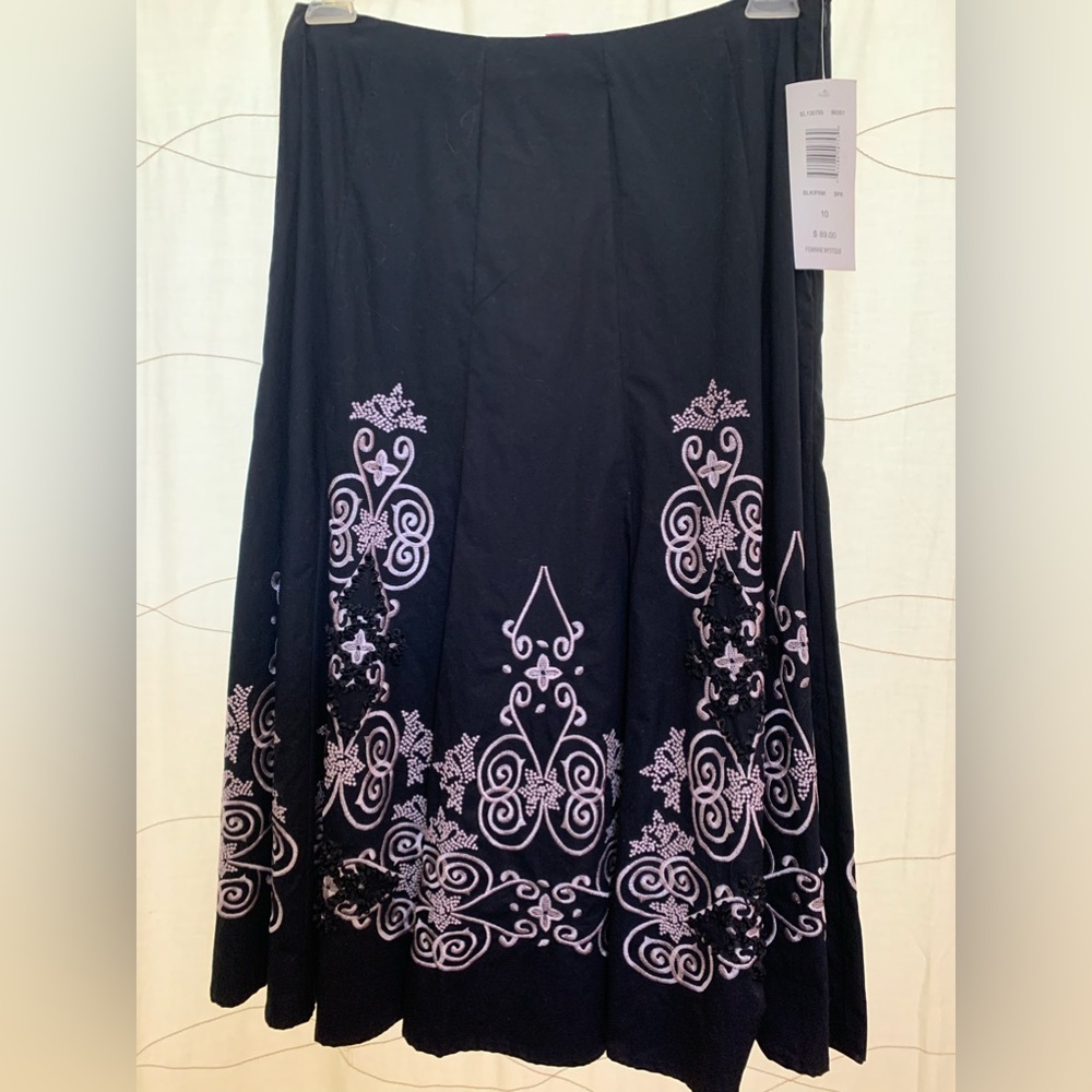 Beautiful skirt. New with tag. Beautiful Light pink and black stitching.